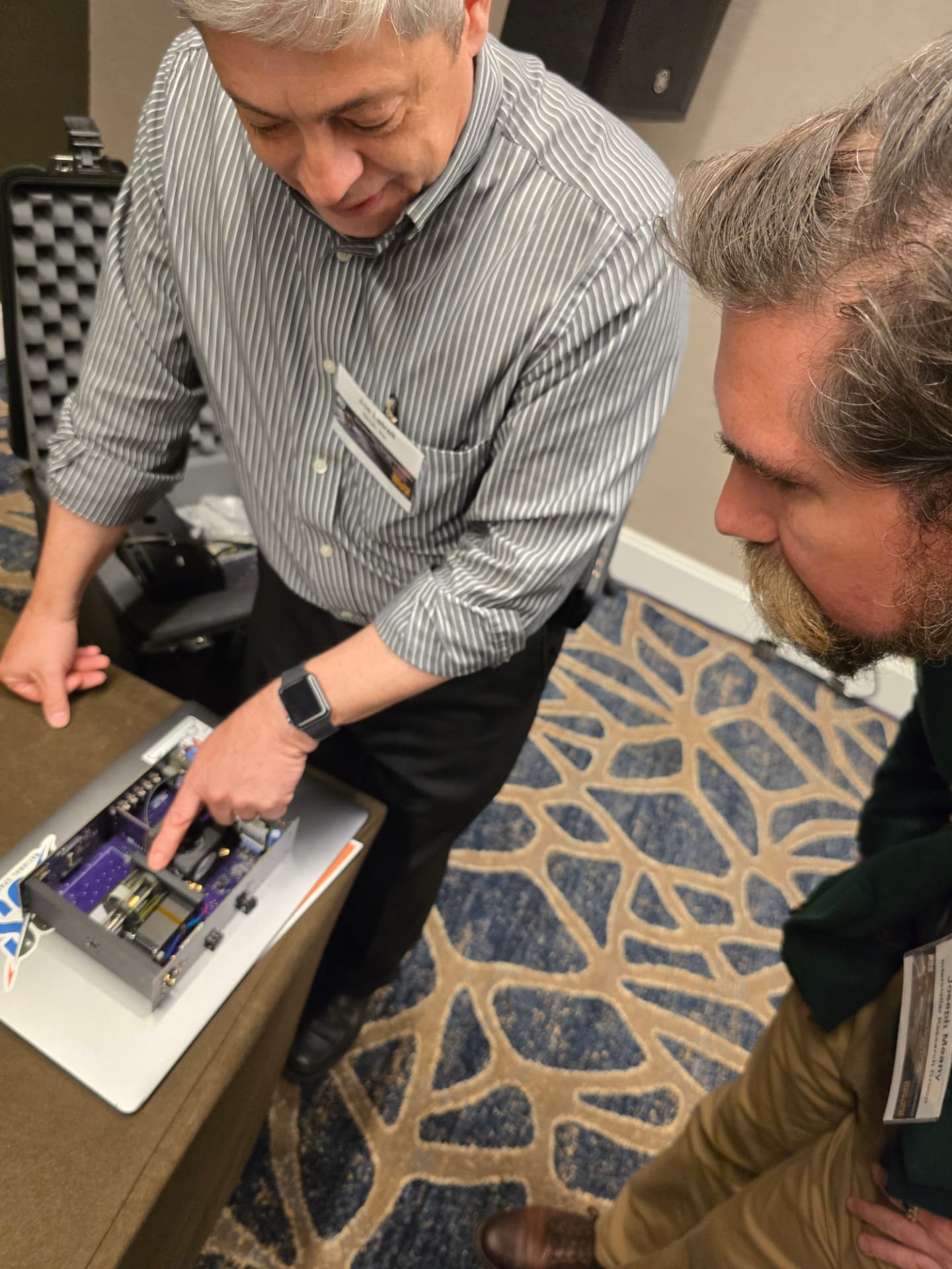Joseph Meany reviewing FastMover hardware with Michael Laine
